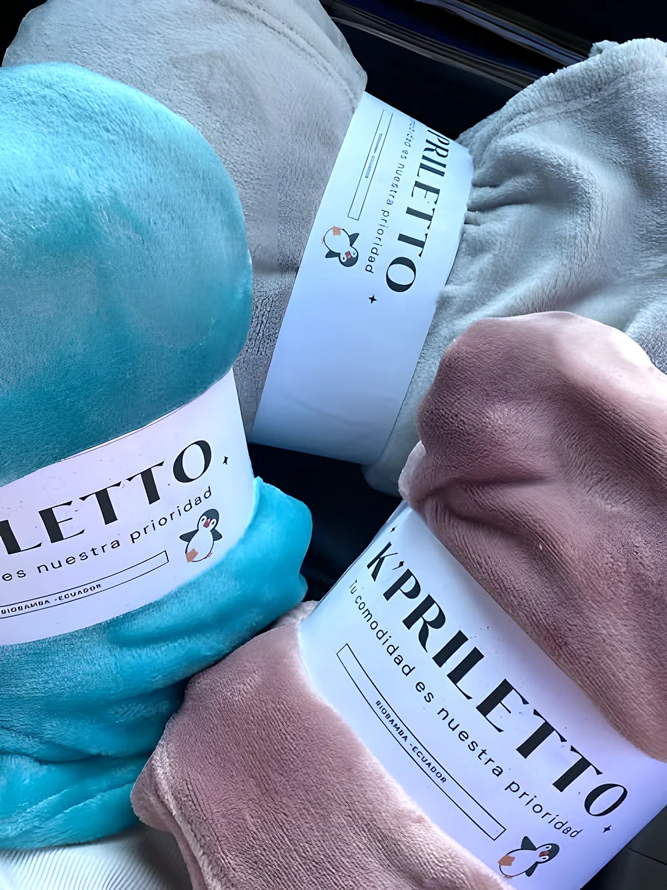 Prendas K'priletto enrolladas con su faja de marca
